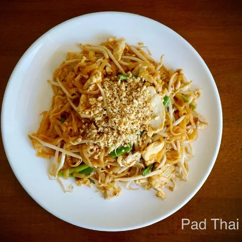 Pad Thai - Stir-fried thin rice noodle with egg, bean sprouts, and scallions topped with ground peanuts.